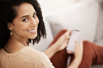 Image showing Black woman, happy with smartphone and smile in portrait, relax on living room sofa with social media or texting. Communication, technology and online, relaxing at home with 5g network and mobile.