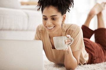Image showing Black woman, coffee and home computer of a person watching a video or writing a remote work email. Digital employee in the morning on a laptop online shopping or streaming series on a house carpet