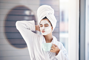 Image showing Woman, facial and drinking coffee after morning shower, happy wellness and healthy skincare cosmetics in home bathroom. Funny, pout lips and young female, face mask and clean beauty cosmetology