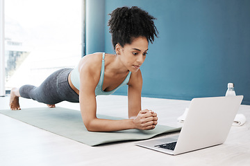 Image showing Wellness, fitness and yoga webinar on laptop for healthy and young black woman in body plank position. Focus, balance and online mindfulness in exercise class with girl on floor in home for health.