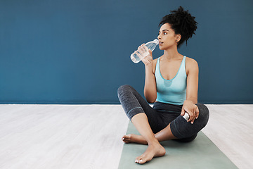 Image showing Tired, fitness or woman drinking water in gym for fitness training, workout exercise or health. Athlete, yoga or relax girl with water bottle for sport hydration, mockup or rest energy in studio