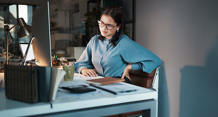 Image showing Business woman, computer or back pain in night office, digital marketing startup or advertising agency company. Tired, stress injury or worker on web design technology and sciatica crisis or burnout