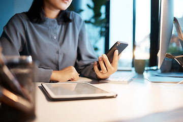 Image showing Tablet, phone and business woman at desk sitting in corporate office working online. Technology, digital marketing and hands of female worker using smartphone for research, internet and social media