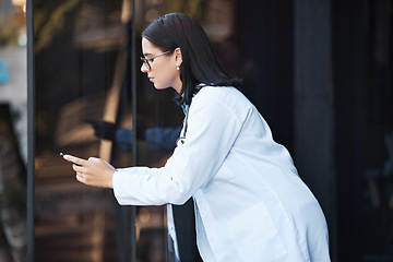 Image showing Woman, doctor and phone on hospital break, clinic balcony or consulting on social media, internet research or schedule planning. Thinking healthcare worker, mobile technology and 5g calendar app