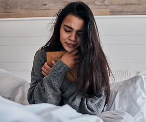 Image showing Sad, loss and woman crying with a photo for memory while in bed in the morning. Depression, tears and girl with a picture frame in the bedroom during grief, sadness and sorrow about death in a house