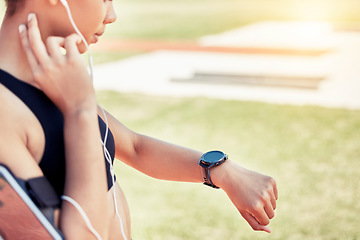 Image showing Smartwatch, pulse and woman runner training for a race, competition or marathon on a field. Fitness, sports and healthy girl athlete checking her health while doing outdoor cardio workout or exercise