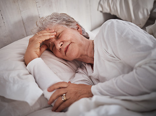 Image showing Elderly woman, sleeping and bed with headache to rest mind, tired body and dreaming for wellness in house. Senior lady, home bedroom and pain while lying in room for health, retirement or stress