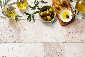 Image showing Olives and olive oil in a bottle, background with copy space, top view