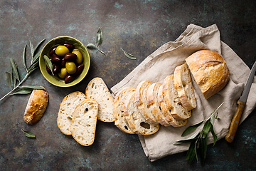 Image showing Ciabatta bread sliced on a board, top view