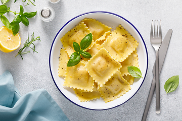 Image showing Ravioli with ricotta cheese and fresh basil, top view