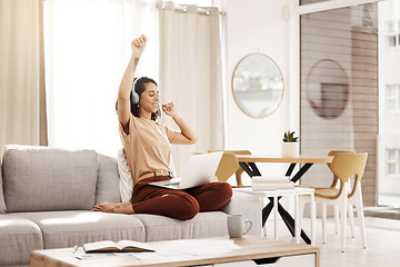 Image showing Music, laptop and woman dance on sofa streaming audio podcast, radio sound or digital online playlist. Work from home, wellness and relax designer listening to download song on fun break