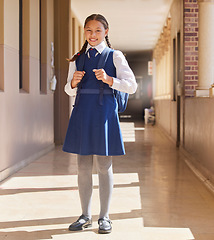 Image showing School, student girl and in uniform for education, class and happy with smile, confident and outdoor. Portrait, female pupil or learner with happiness, pride or ready for lesson, teaching or studying