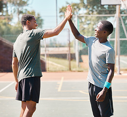 Image showing Fitness, high five and men on a basketball court for a game, practice or training together. Happy, celebration and male team with success after a match, tournament or competition on an outdoor court.