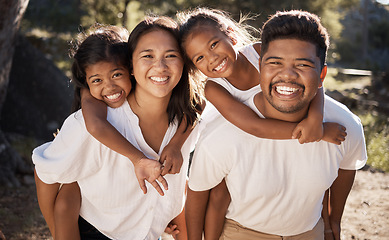 Image showing Family, piggy back and happiness portrait of a mother, father and girl children in a outdoor park. Happy, smile and parent care of a mom, dad and kids together bonding with love on a summer vacation