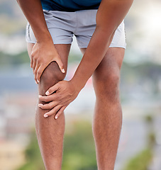 Image showing Man, legs and running injury in nature park for wellness exercise, medical accident or sports emergency. Black man, athlete and runner knee pain, joint pain or orthopedic arthritis pain in outdoors