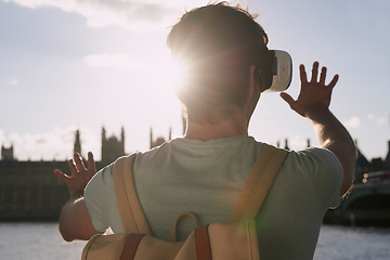 Image showing Virtual reality glasses, man back and outdoor metaverse adventure, 3d futuristic software and gaming innovation. Ai technology, vr fantasy video and online cyber streaming or digital headset in city