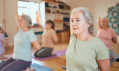 Image showing Fitness, yoga and senior women stretching and training body, breathing and mindfulness together in a studio. Wellness, meditation and zen elderly people exercise in retirement with a cow face pose