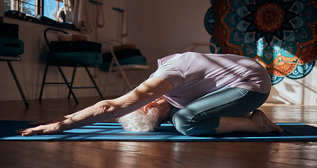 Image showing Senior woman, stretching and yoga exercise in living room for fitness, cardio and wellness on mat studio training. Retirement, workout and pilates elderly retired person exercising legs on floor