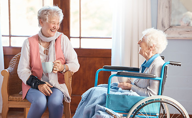 Image showing Disabled senior woman, friends and coffee with smile, funny conversation or talking with laugh, wheelchair or happy. Elderly women, drinking tea ort enjoy communication, joke and bond in retirement