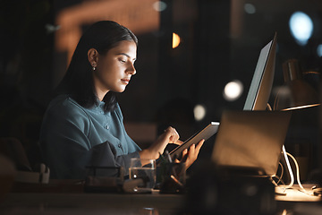 Image showing Woman, office and table on internet at night for overtime, working or digital marketing with technology. Professional businesswoman, late and tech for web, email or communication on app in workplace