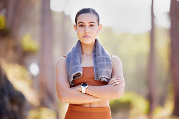 Image showing Woman portrait, fitness and serious face outdoor ready for training, exercise and running sport. Wellness, sports health and workout start of a runner athlete in nature with arms crossed