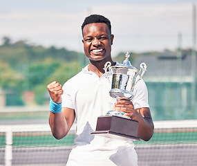 Image showing Celebration, tennis and black man with trophy on court after success, achievement and winning tournament. Fitness, champion and tennis player with award from win in sports game, event and competition