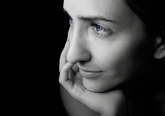 Image showing Blue-eyed girl with an easy smile on the lips