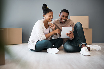 Image showing Tablet, box and moving with black couple in new house for planning, real estate and property. Investment, goals and future with man and woman in new home with technology, internet and growth