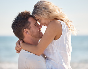 Image showing Beach, love and couple nose touch with smile for romance, bond and happiness with carrying hug. Partner, holiday and Canada ocean embrace in summer for happy, relaxing and intimate memory.