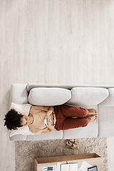 Image showing Above view, black woman and sofa of a person on phone wifi looking at web and social media app. Living room lounge couch of a woman using mobile technology to relax at home in the morning on internet
