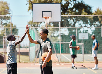 Image showing Basketball court, high five and team sports, success and support, winners and achievement outdoor. Excited basketball player community, men and friends, celebration goals and competition motivation