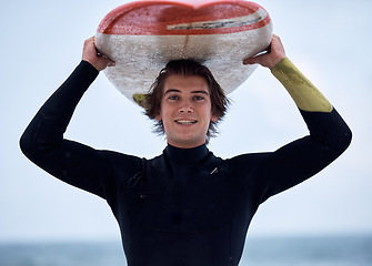 Image showing Portrait of happy surfer, man with surfboard and ocean surfing sport outdoors for free fitness, exercise and water training. Beach surf, sea wetsuit and fun Australia summer wellness freedom workout