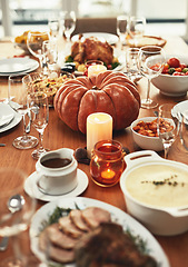 Image showing Thanksgiving, festival celebration and food on table ready to eat on holiday, vacation and traditional party. Festive, Christmas and delicious feast with pumpkin, turkey and meat on dinner table