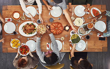 Image showing Top view, holiday dinner and thanksgiving table in social home, house or restaurant with festive food. Above, dining room or friends group with diversity, celebration or lunch with happiness together