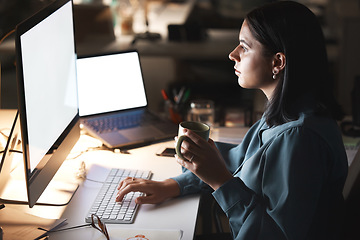 Image showing Computer, laptop and woman at night working with mockup screen at it company office. Coffee, late and programmer employee working on project deadline in professional workspace with focus.