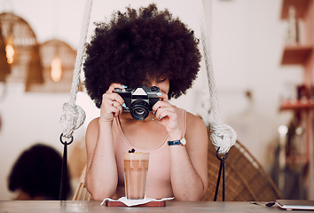 Image showing Camera, photography and woman in coffee shop for content marketing, drink advertising and menu update on website or social media. Black woman influencer, photographer or content creator in restaurant