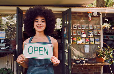 Image showing Open sign, black woman and garden shop owner of a small business manager portrait happy. Smile of a retail store entrepreneur with welcome shopping board and business owner with plant products