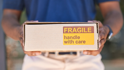 Image showing Hands, logistics and box for special delivery, cargo or handle with care sign for shipping. Hand in deliver holding fragile cardboard box packaging for online purchase, export or courier service