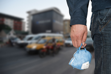 Image showing A man in the city with medical mask