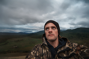 Image showing Caucasian man in the mountain making selfie