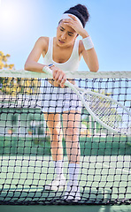 Image showing Tired woman on tennis court, headache pain in sports or rest after match mistake in South Africa. Young athlete frustrated by score, tennis player training with racket and stress of performance