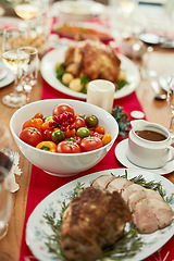 Image showing Christmas food, roast beef or tomato vegetables on dining table in empty house, home or restaurant. Zoom, texture and festive meat, ham or thanksgiving turkey in social gathering or lunch celebration