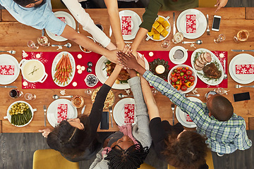 Image showing Hands, unity and Christmas with a table setting for dinner or a celebration even with friends from above. Food, together and motivation with a group of people bonding during a meal in the holidays