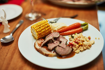 Image showing Home cooking, plate of food and Christmas celebration at dinner table for healthy thanksgiving holiday. Setting for dinner party with vegetables, meat and salad, luxury lunch to celebrate vacation.