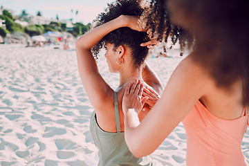 Image showing Woman, friends and back sunscreen at the beach for healthy skincare, protection or moisturizer in the outdoors. Hands of female helping friend apply SPF, sunblock or lotion in care for health or skin