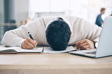 Image showing Tired businessman, sleeping and desk on notebook from burnout or overworked at the office. Exhausted male employee asleep holding pen during writing, working or documents suffering from work fatigue