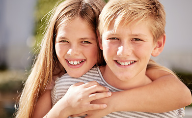 Image showing Girl, boy and portrait in family, smile and happy siblings in home backyard, garden and hug together. Kids, brother and sister with love, bonding and care in summer sunshine, outdoor and happiness