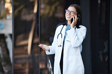 Image showing Doctor, phone call and talking for communication, funny conversation and telehealth with contact outdoor in the city. Medical worker, healthcare expert or woman speaking on mobile smartphone on break