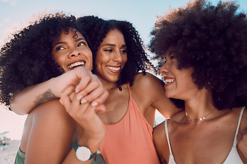 Image showing Black women, relax and friends hug at beach, having fun and bonding. Travel, freedom and group of females embrace outdoors on seashore, smiling or laughing, talking and enjoying quality time together