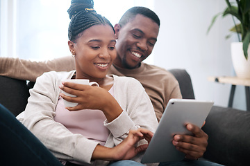 Image showing Digital tablet, relax and black couple on a sofa scrolling on social media, mobile app or the internet. Happy, smile and African man and woman reading messages together on a device in the living room
